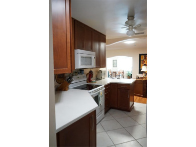 This attached home is located in Kings Point, one of Florida's on Falcon Watch Golf Club in Florida - for sale on GolfHomes.com, golf home, golf lot