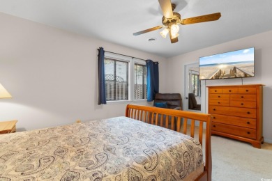 Nestled less than a mile from the pristine shores of North on Beachwood Golf Club in South Carolina - for sale on GolfHomes.com, golf home, golf lot