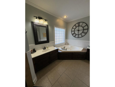 Summertime and the living is easy at this spacious 3 bedroom, 2 on Big Oaks Golf Club in Mississippi - for sale on GolfHomes.com, golf home, golf lot