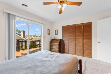Nestled less than a mile from the pristine shores of North on Beachwood Golf Club in South Carolina - for sale on GolfHomes.com, golf home, golf lot