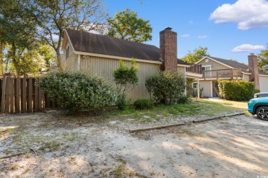 Nestled less than a mile from the pristine shores of North on Beachwood Golf Club in South Carolina - for sale on GolfHomes.com, golf home, golf lot