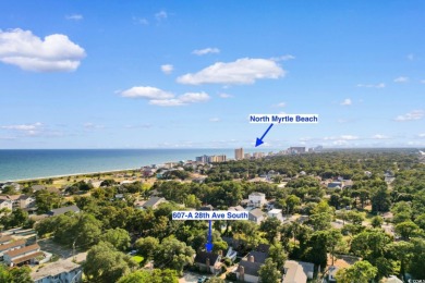 Nestled less than a mile from the pristine shores of North on Beachwood Golf Club in South Carolina - for sale on GolfHomes.com, golf home, golf lot