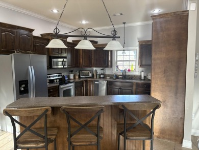 Summertime and the living is easy at this spacious 3 bedroom, 2 on Big Oaks Golf Club in Mississippi - for sale on GolfHomes.com, golf home, golf lot