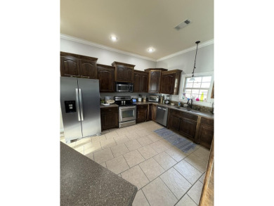 Summertime and the living is easy at this spacious 3 bedroom, 2 on Big Oaks Golf Club in Mississippi - for sale on GolfHomes.com, golf home, golf lot