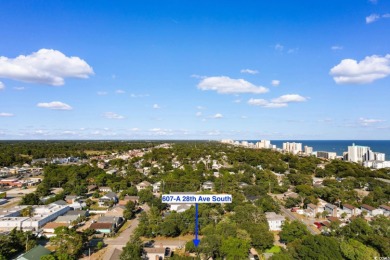 Nestled less than a mile from the pristine shores of North on Beachwood Golf Club in South Carolina - for sale on GolfHomes.com, golf home, golf lot