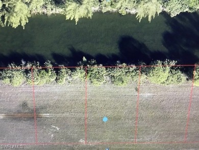 This double lot is perfect if you love living on the water in a on Del Tura Golf and Country Club in Florida - for sale on GolfHomes.com, golf home, golf lot