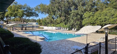 This two-bedroom, two-bath split-bedroom plan home is located in on Royal Oaks Golf Club in Florida - for sale on GolfHomes.com, golf home, golf lot