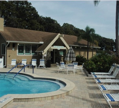 Charming 1-Bedroom End Unit Condo for 55+ buyers with access to on Highland Lakes Executive Golf Course in Florida - for sale on GolfHomes.com, golf home, golf lot