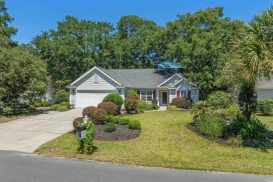 Meticulously maintained 3-bedroom, 2-bathroom home, perfectly on Pawleys Plantation Golf and Country Club in South Carolina - for sale on GolfHomes.com, golf home, golf lot