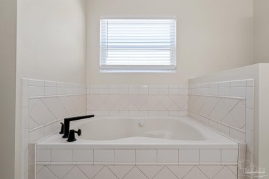 Welcome to this beautifully updated 3-bedroom, 2-bathroom home on Perdido Bay Golf Club in Florida - for sale on GolfHomes.com, golf home, golf lot