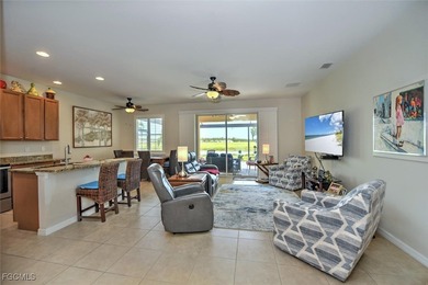 Turnkey with stunning lake and golf course views! This home on Herons Glen Golf and Country Club in Florida - for sale on GolfHomes.com, golf home, golf lot