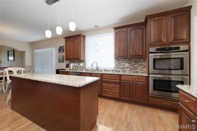 STUNNING 1.5 story villa overlooking the 8th green of on Winghaven Country Club in Missouri - for sale on GolfHomes.com, golf home, golf lot