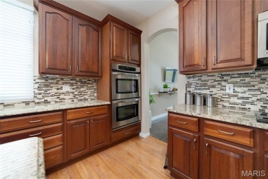 STUNNING 1.5 story villa overlooking the 8th green of on Winghaven Country Club in Missouri - for sale on GolfHomes.com, golf home, golf lot