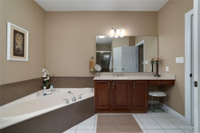 STUNNING 1.5 story villa overlooking the 8th green of on Winghaven Country Club in Missouri - for sale on GolfHomes.com, golf home, golf lot
