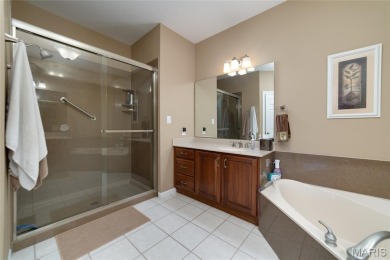 STUNNING 1.5 story villa overlooking the 8th green of on Winghaven Country Club in Missouri - for sale on GolfHomes.com, golf home, golf lot