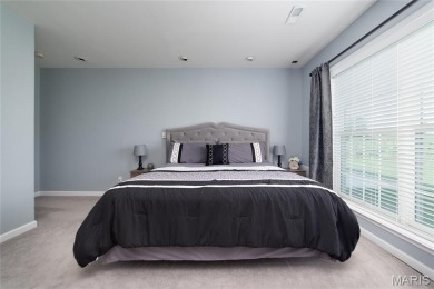 STUNNING 1.5 story villa overlooking the 8th green of on Winghaven Country Club in Missouri - for sale on GolfHomes.com, golf home, golf lot