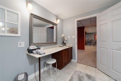 STUNNING 1.5 story villa overlooking the 8th green of on Winghaven Country Club in Missouri - for sale on GolfHomes.com, golf home, golf lot
