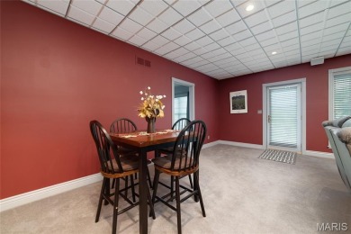 STUNNING 1.5 story villa overlooking the 8th green of on Winghaven Country Club in Missouri - for sale on GolfHomes.com, golf home, golf lot