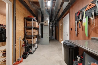 STUNNING 1.5 story villa overlooking the 8th green of on Winghaven Country Club in Missouri - for sale on GolfHomes.com, golf home, golf lot