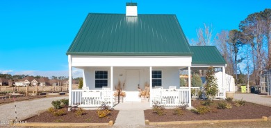Awesome building lot with golf and pond views from your on Ocean Ridge Plantation in North Carolina - for sale on GolfHomes.com, golf home, golf lot