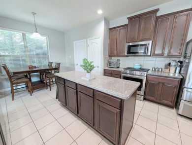 Welcome to this beautifully maintained 4-bedroom, 3.5-bathroom on Frisco Lakes Golf Course in Texas - for sale on GolfHomes.com, golf home, golf lot
