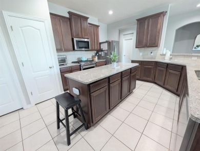 Welcome to this beautifully maintained 4-bedroom, 3.5-bathroom on Frisco Lakes Golf Course in Texas - for sale on GolfHomes.com, golf home, golf lot