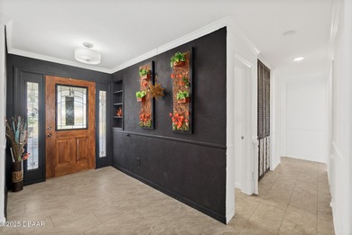 Discover the perfect blend of modern style and relaxed Florida on Daytona Beach Golf Club in Florida - for sale on GolfHomes.com, golf home, golf lot