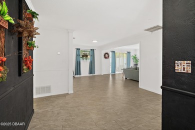 Discover the perfect blend of modern style and relaxed Florida on Daytona Beach Golf Club in Florida - for sale on GolfHomes.com, golf home, golf lot