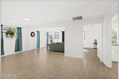 Discover the perfect blend of modern style and relaxed Florida on Daytona Beach Golf Club in Florida - for sale on GolfHomes.com, golf home, golf lot