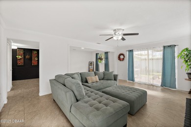 Discover the perfect blend of modern style and relaxed Florida on Daytona Beach Golf Club in Florida - for sale on GolfHomes.com, golf home, golf lot