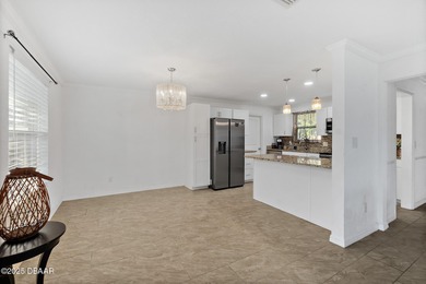 Discover the perfect blend of modern style and relaxed Florida on Daytona Beach Golf Club in Florida - for sale on GolfHomes.com, golf home, golf lot