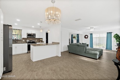 Discover the perfect blend of modern style and relaxed Florida on Daytona Beach Golf Club in Florida - for sale on GolfHomes.com, golf home, golf lot