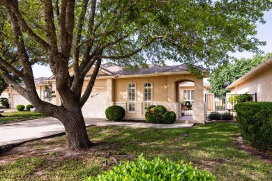 Charming garden home with lovely front courtyard sits across on The Club At Comanche Trace in Texas - for sale on GolfHomes.com, golf home, golf lot
