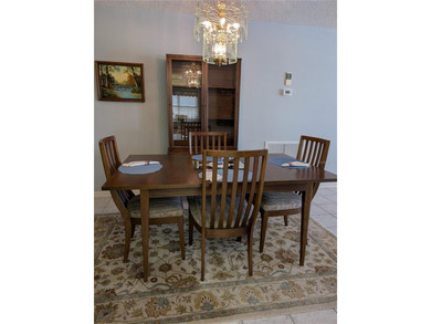 Immaculate *PHILODENDRON* w/private backyard, centrally located on Mainlands Golf Club in Florida - for sale on GolfHomes.com, golf home, golf lot