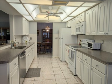 Immaculate *PHILODENDRON* w/private backyard, centrally located on Mainlands Golf Club in Florida - for sale on GolfHomes.com, golf home, golf lot