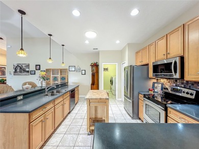 Welcome to your private retreat in the heart of the greens! This on Plantation Golf Club in Florida - for sale on GolfHomes.com, golf home, golf lot