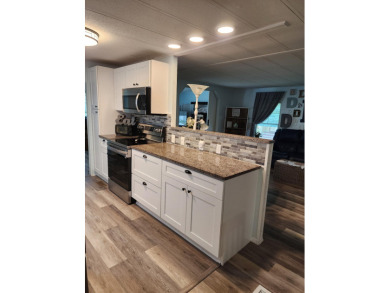 Move-in ready and fully upgraded! Check out this beautiful on Spanish Lakes Country Club in Florida - for sale on GolfHomes.com, golf home, golf lot
