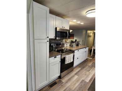 Move-in ready and fully upgraded! Check out this beautiful on Spanish Lakes Country Club in Florida - for sale on GolfHomes.com, golf home, golf lot