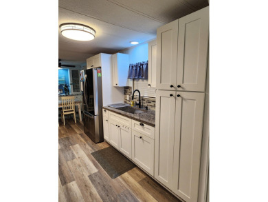 Move-in ready and fully upgraded! Check out this beautiful on Spanish Lakes Country Club in Florida - for sale on GolfHomes.com, golf home, golf lot