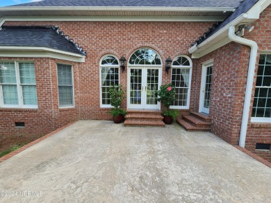 Discover this stunning all-brick home in the prestigious Cypress on Cypress Landing Golf Club in North Carolina - for sale on GolfHomes.com, golf home, golf lot