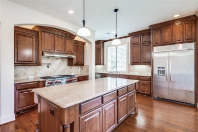 Nestled on a premier GOLF COURSE lot overlooking the tee box of on Lantana Golf Club in Texas - for sale on GolfHomes.com, golf home, golf lot