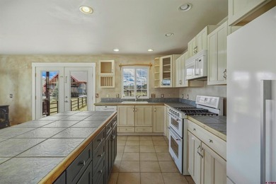 Lakefront mountain living, exceptionally priced. Single-level on Pagosa Springs Golf Club in Colorado - for sale on GolfHomes.com, golf home, golf lot