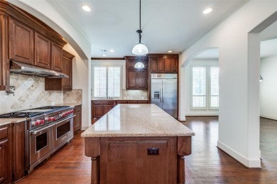 Nestled on a premier GOLF COURSE lot overlooking the tee box of on Lantana Golf Club in Texas - for sale on GolfHomes.com, golf home, golf lot
