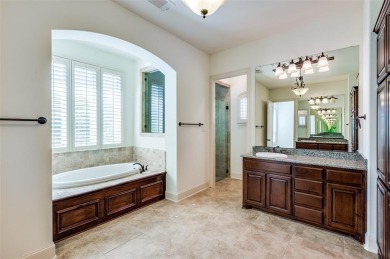 Nestled on a premier GOLF COURSE lot overlooking the tee box of on Lantana Golf Club in Texas - for sale on GolfHomes.com, golf home, golf lot