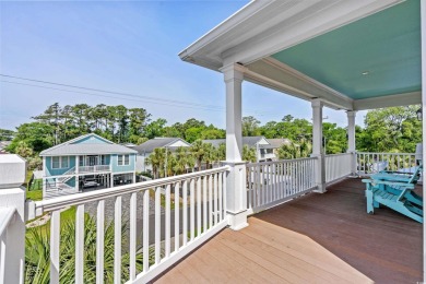 Welcome home to this beautiful, raised beach house with an on Surf Golf and Beach Club in South Carolina - for sale on GolfHomes.com, golf home, golf lot