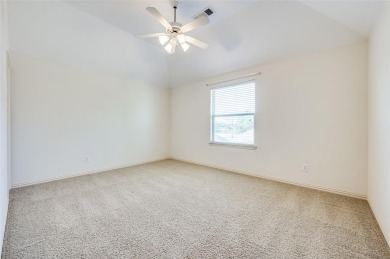 Nestled on a premier GOLF COURSE lot overlooking the tee box of on Lantana Golf Club in Texas - for sale on GolfHomes.com, golf home, golf lot
