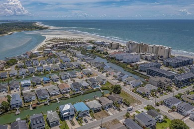 Welcome home to this beautiful, raised beach house with an on Surf Golf and Beach Club in South Carolina - for sale on GolfHomes.com, golf home, golf lot