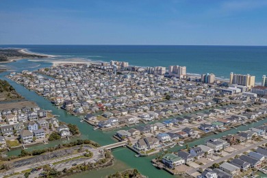 Welcome home to this beautiful, raised beach house with an on Surf Golf and Beach Club in South Carolina - for sale on GolfHomes.com, golf home, golf lot