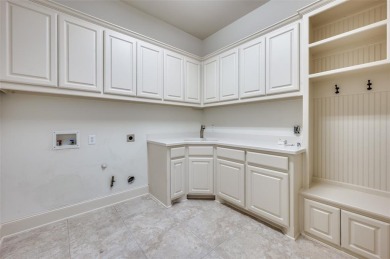 Nestled on a premier GOLF COURSE lot overlooking the tee box of on Lantana Golf Club in Texas - for sale on GolfHomes.com, golf home, golf lot