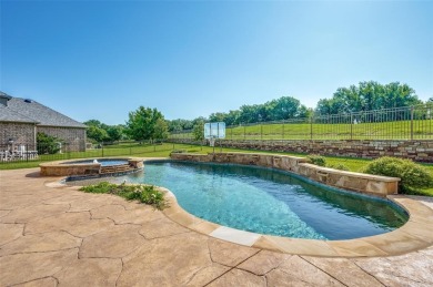 Nestled on a premier GOLF COURSE lot overlooking the tee box of on Lantana Golf Club in Texas - for sale on GolfHomes.com, golf home, golf lot